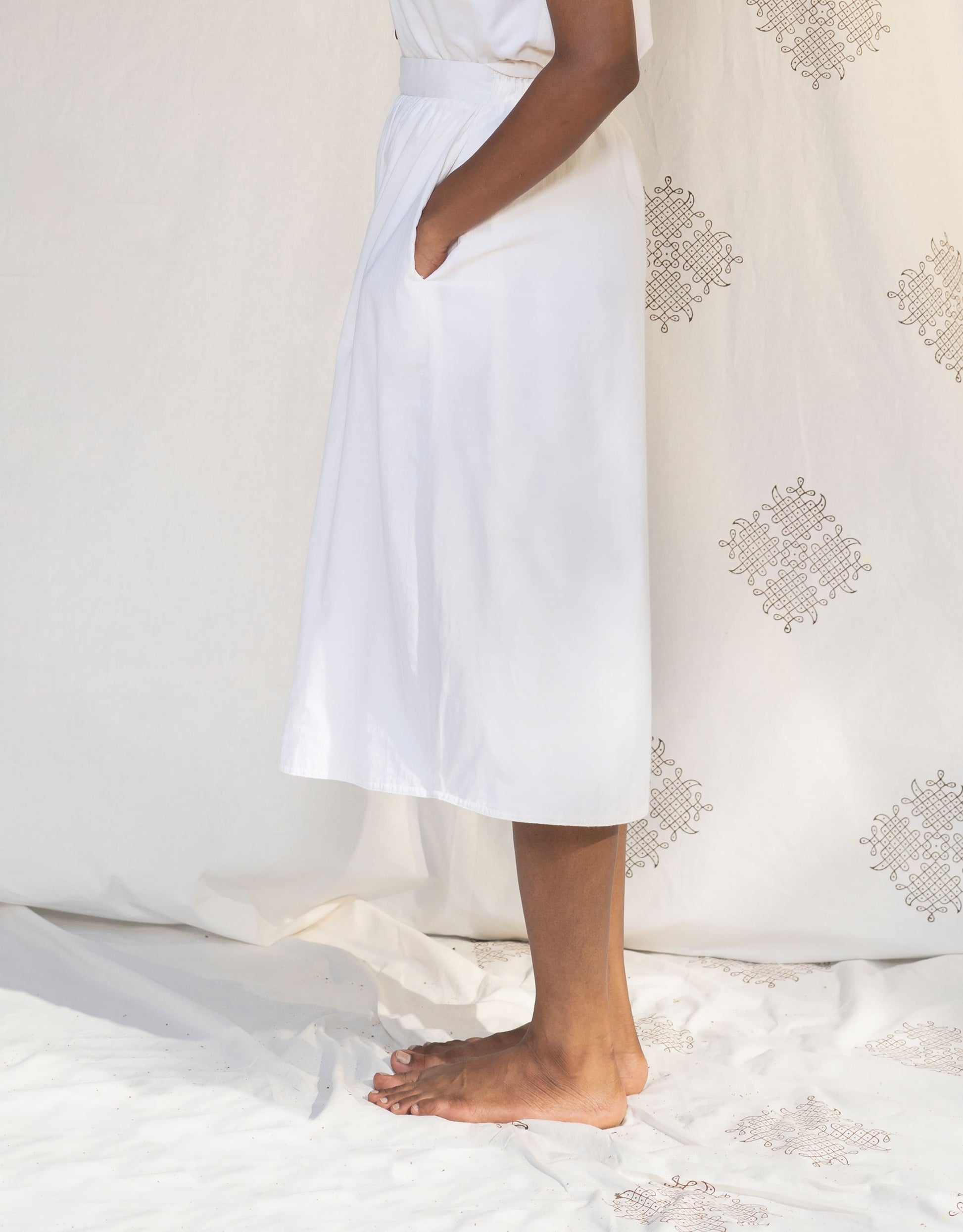 Side view of Hueloom's Reversible Midi Skirt in Off-White