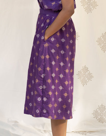 Side view of Hueloom's Reversible Midi Skirt in Purple Kolam print