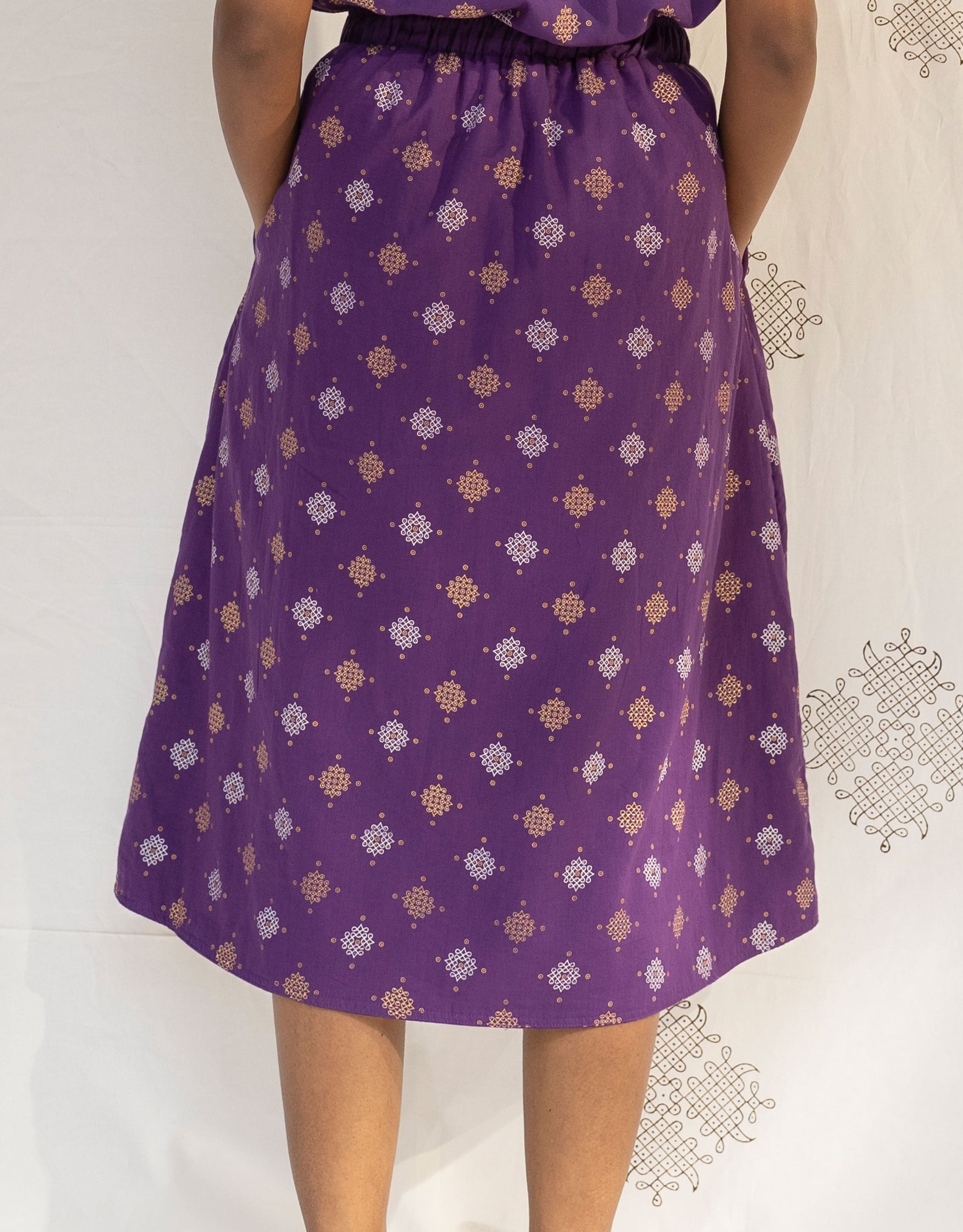 Back view of Hueloom's Reversible Midi Skirt in Purple Kolam print.