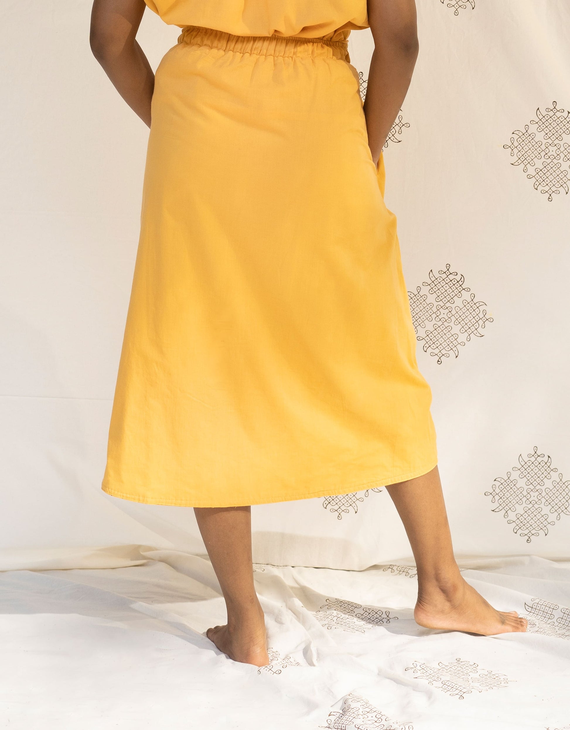 Back view of Hueloom's Reversible Midi Skirt in Yellow