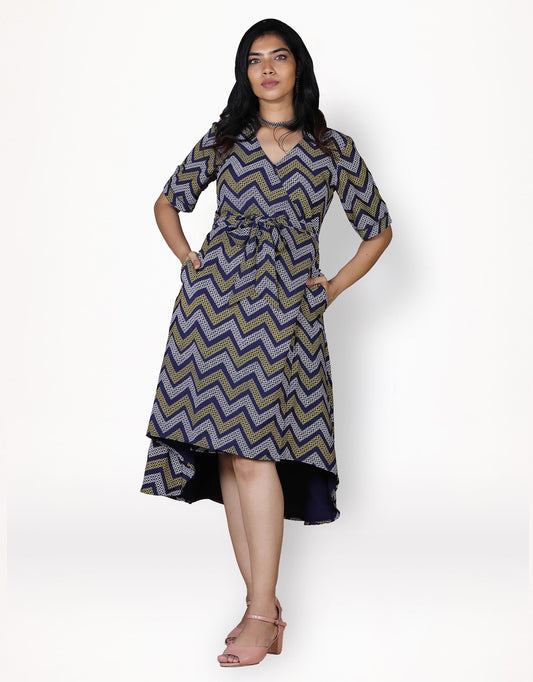 Front view of Hueloom's convertible wrap dress in navy with kolam print.