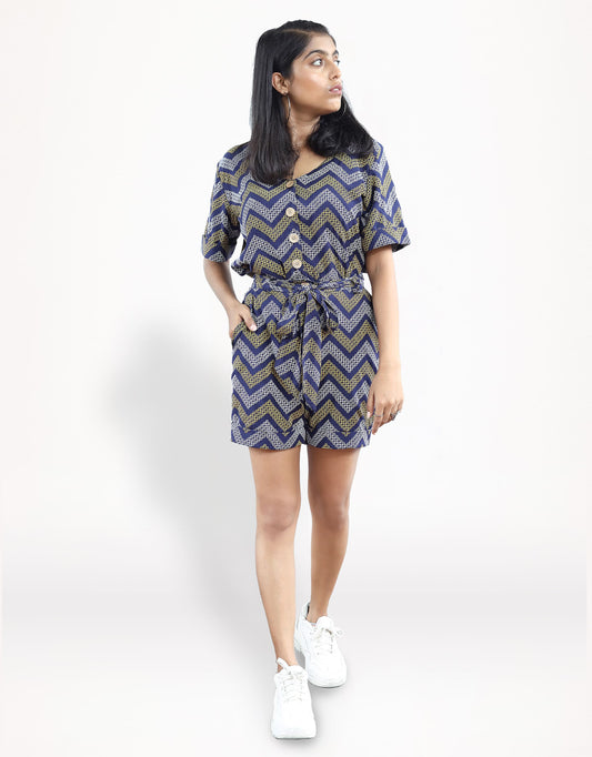 Front view of Hueloom's detachable romper in navy with kolam print.