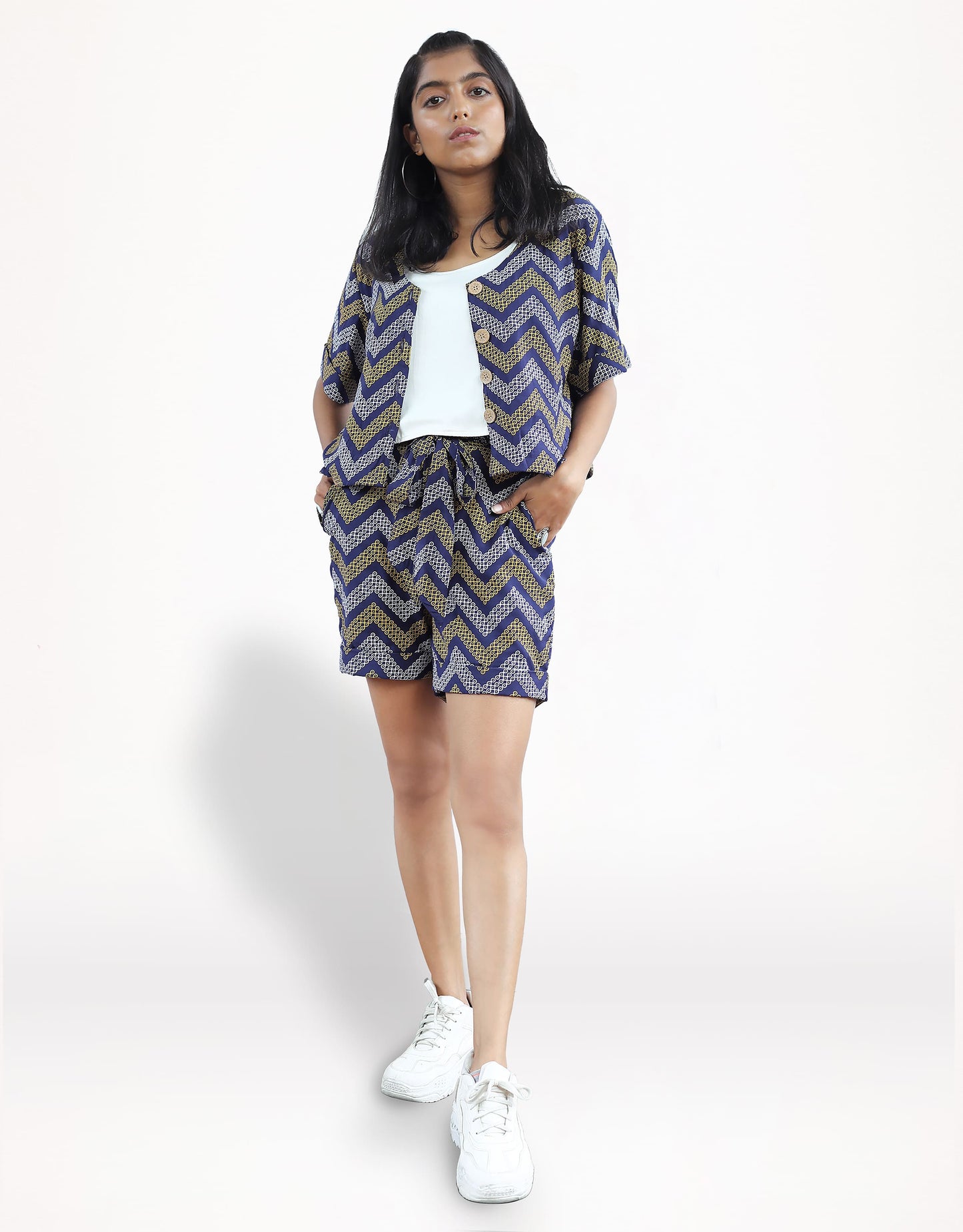 Front view of Hueloom's detachable romper in navy kolam print with ensemble.