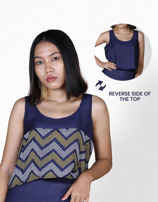 Front closeup view of Hueloom's reversible top in navy kolam print with plain reverse side.