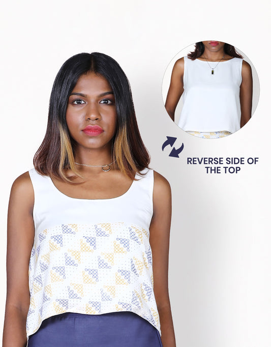 Front closeup view of Hueloom's reversible top in white with kolam print on reverse side.