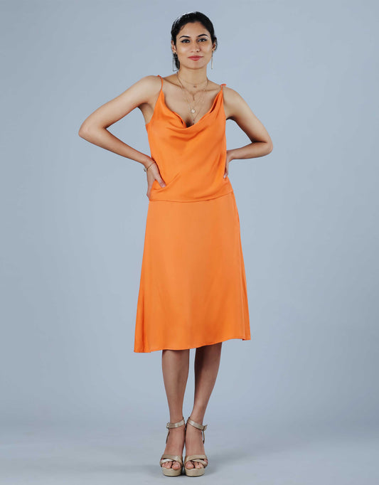 Hueloom's orange 2 piece dress with cowl neck top and skirt.