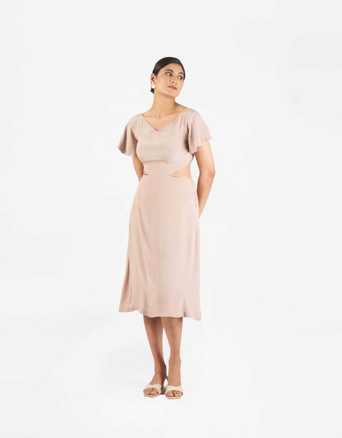 Front view of Hueloom's Reversible Cut-out dress in champagne.