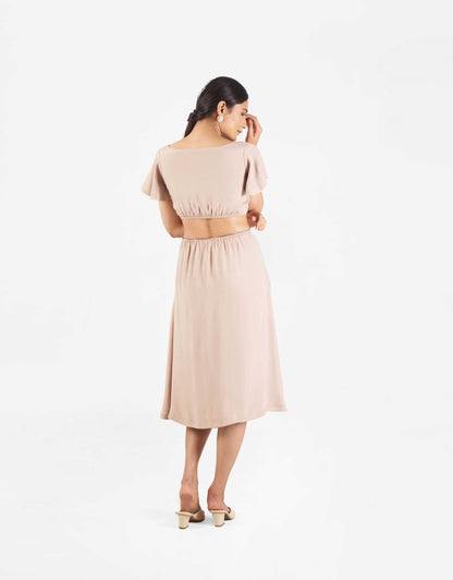 Back view of Hueloom's Reversible Cut-out dress in champagne.