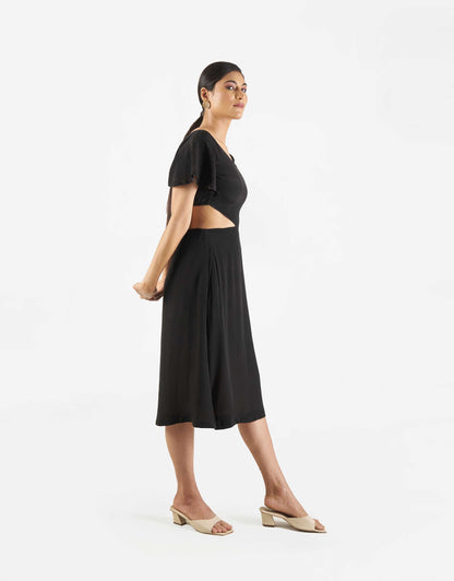 Side view of Hueloom's Reversible Cut-out dress in black.