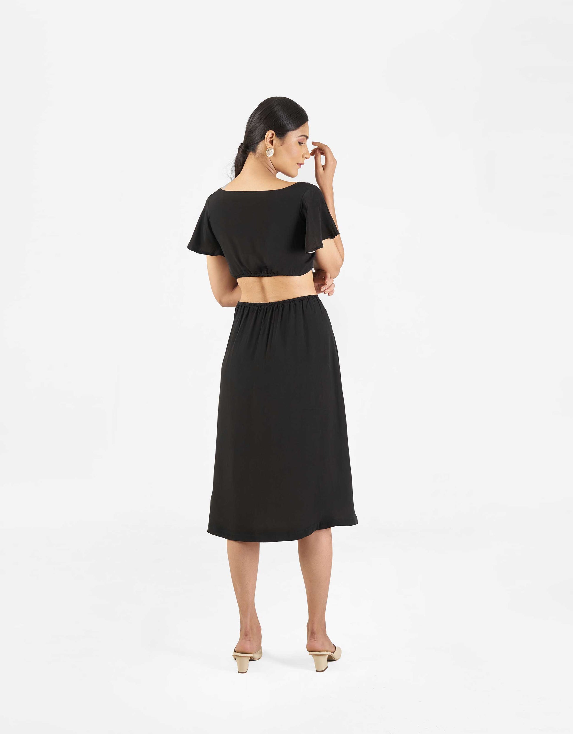 Back view of Hueloom's Reversible Cut-out dress in black.
