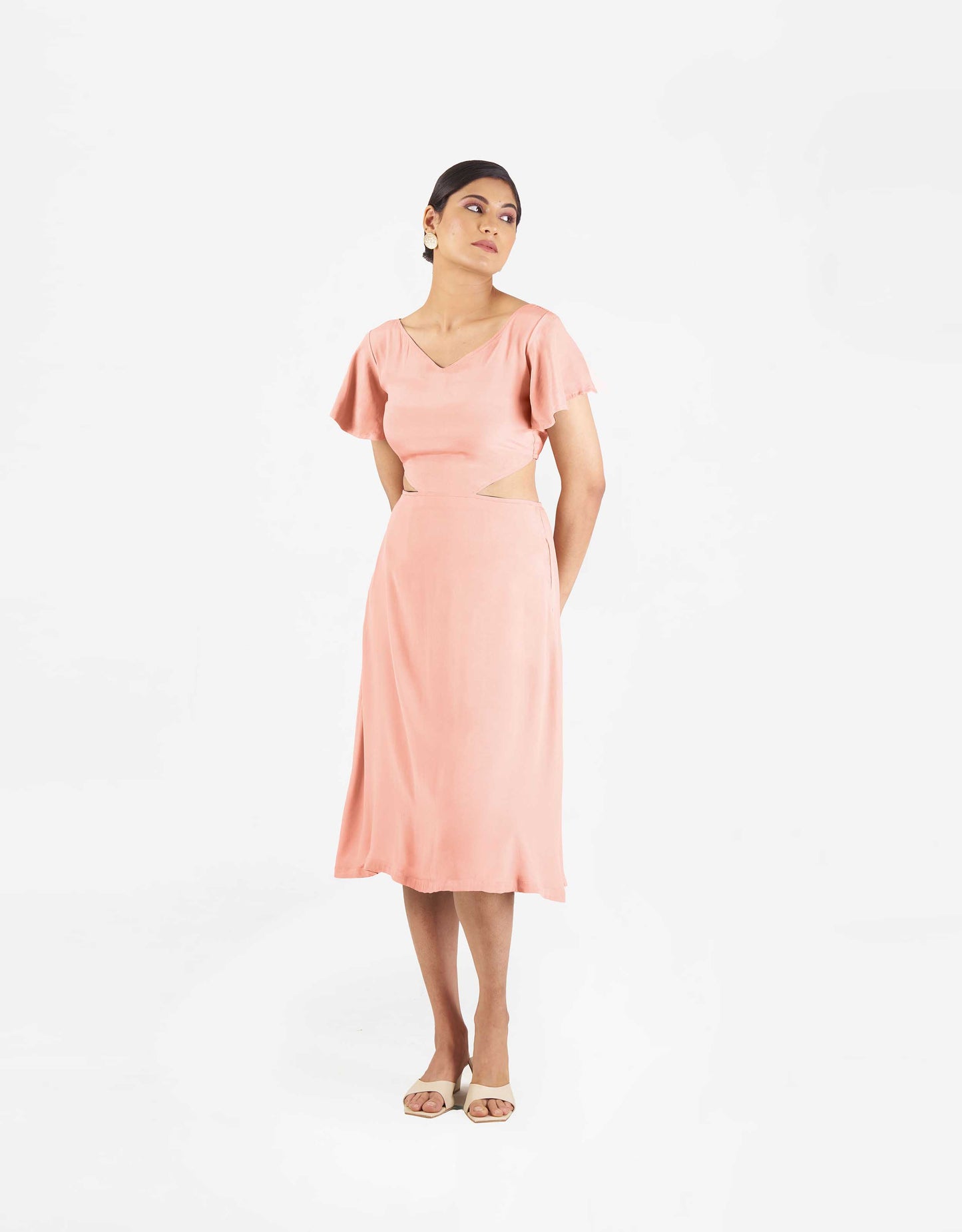 Front view of Hueloom's Reversible Cut-out dress in coral.