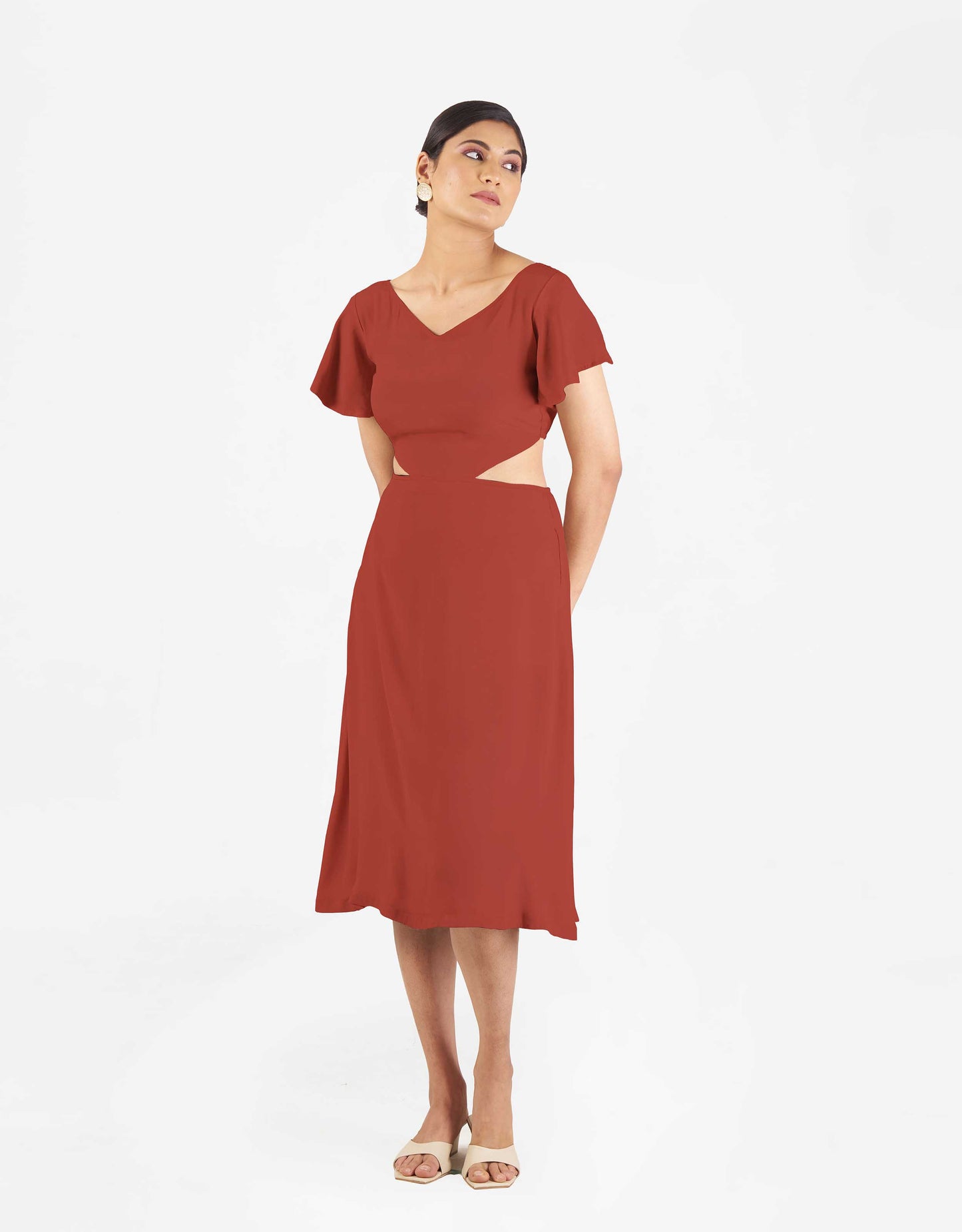 Front view of Hueloom's Reversible Cut-out dress in rust colour.