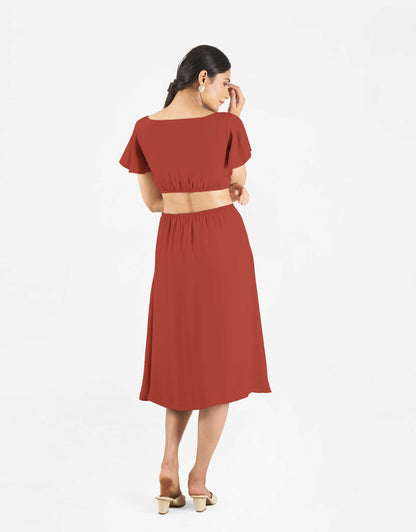 Back view of Hueloom's Reversible Cut-out dress in rust colour.