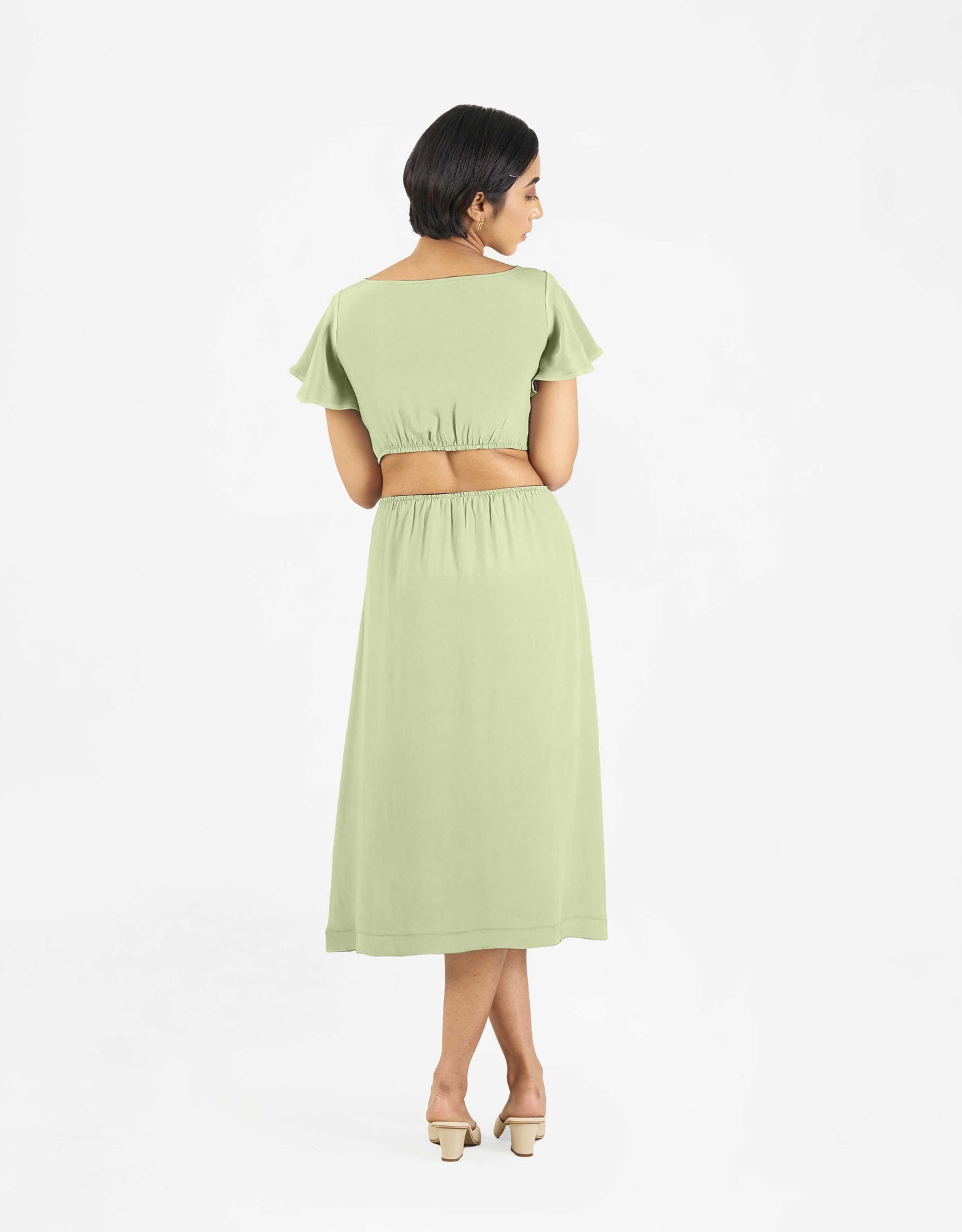 Back view of Hueloom's Reversible Cut-out dress in mint green.