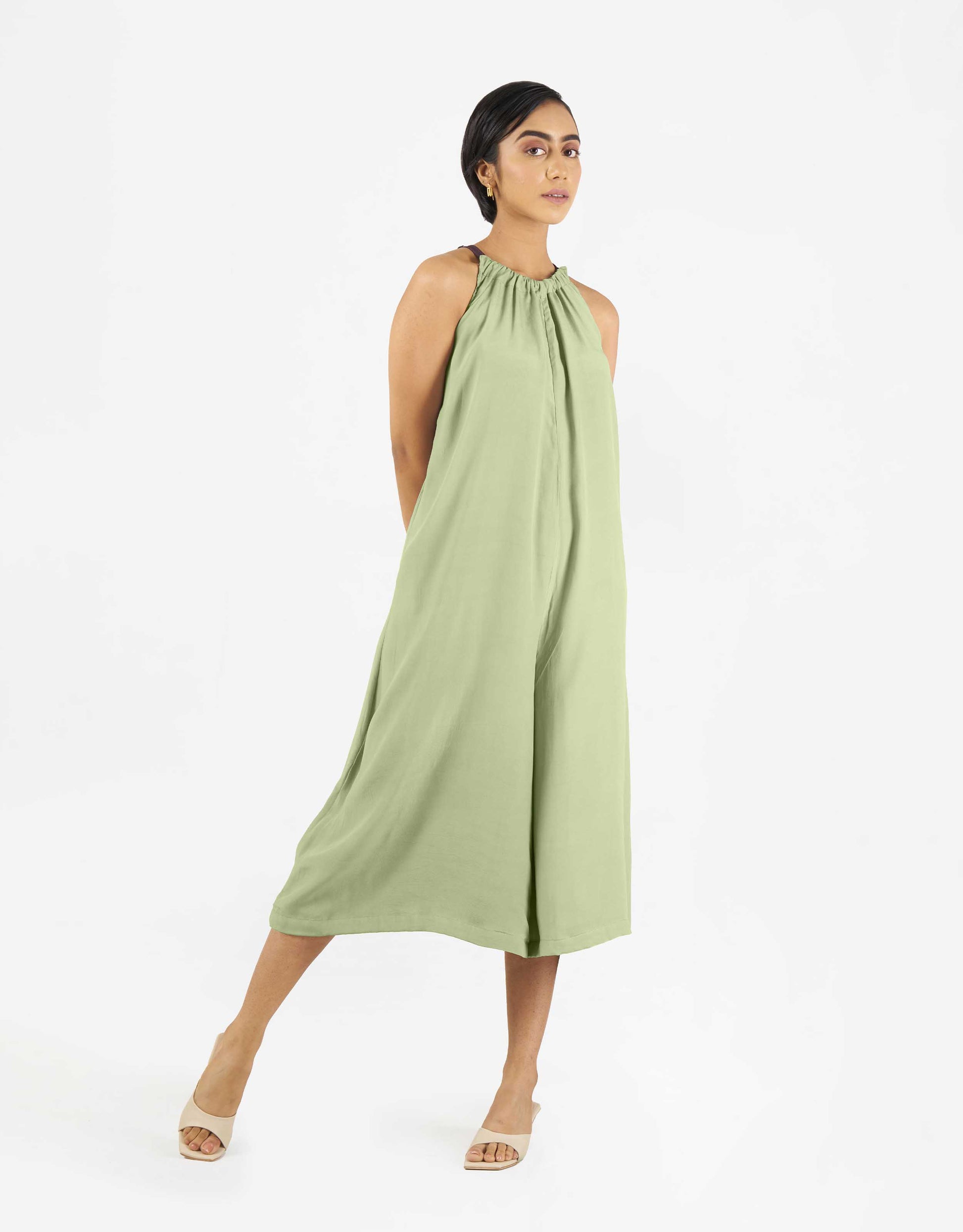 Front view of Hueloom's Reversible jumpsuit in mint green.