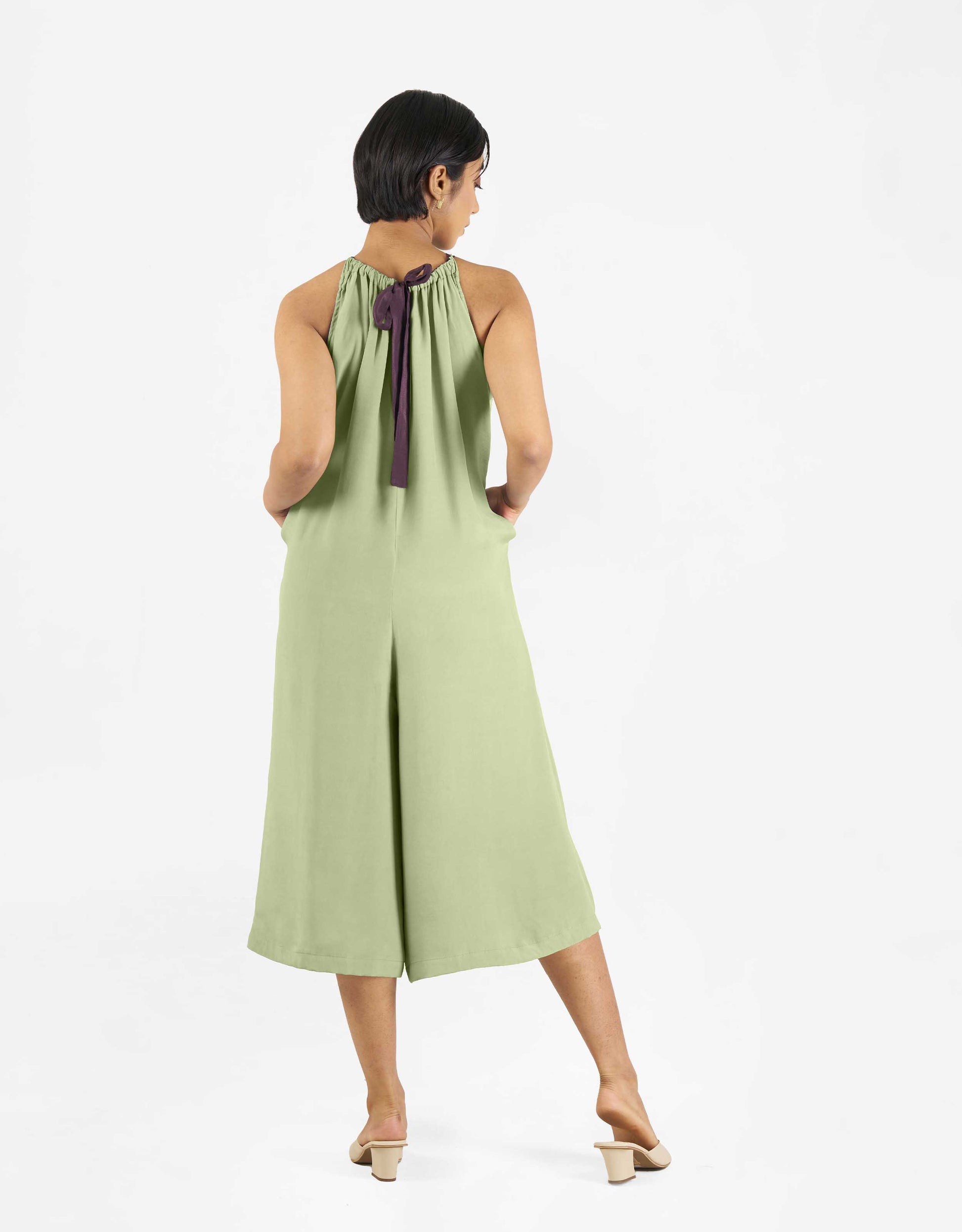 Back view of Hueloom's Reversible jumpsuit in mint green.