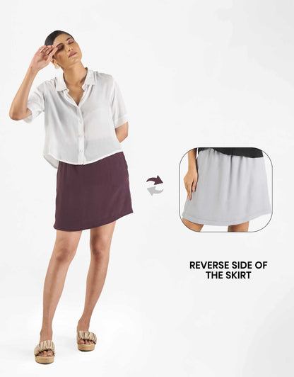 Front view of Hueloom's star-ter capsule with boxy shirt and skirt in white, purple and grey with reverse side.
