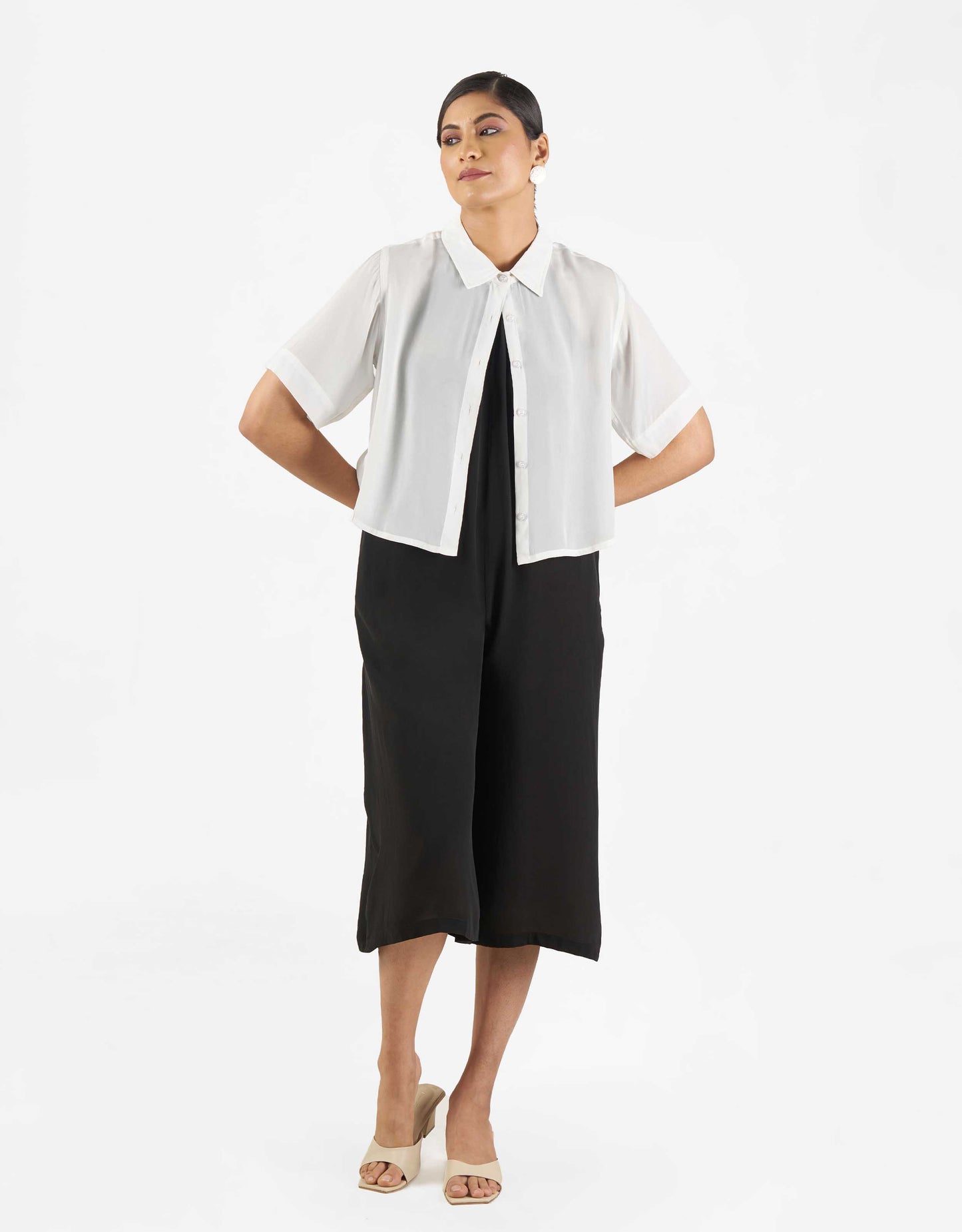 Front view of Hueloom's suit-up capsule with boxy shirt and jumpsuit in black and white.
