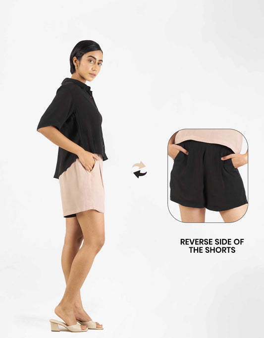 Side view of Hueloom's sure shot capsule with boxy shirt and shorts in black and champagne with black reverse side and pockets.