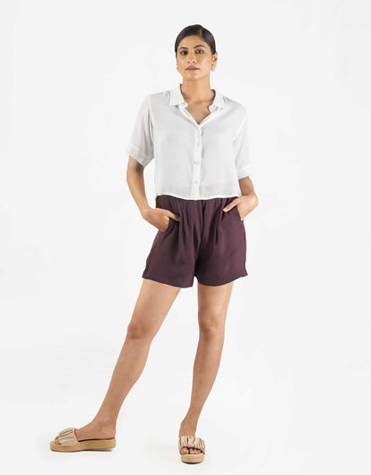 Front view of Hueloom's Boxy shirt in white with shorts.