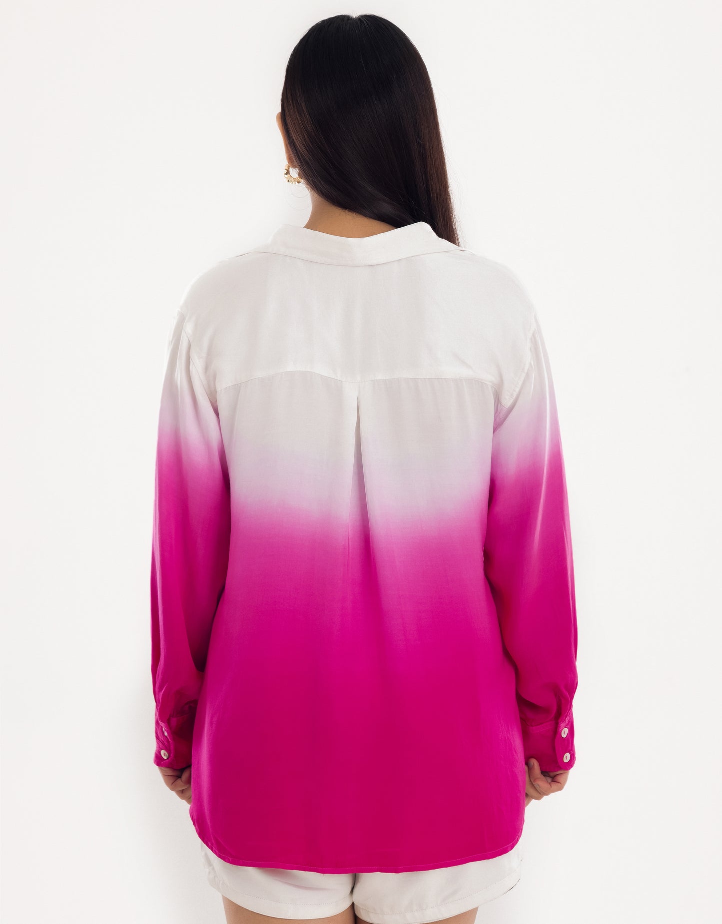 Back view display of Hueloom's Cosmopolitan capsule with oversized shirt, bandeau top and shorts in pink.