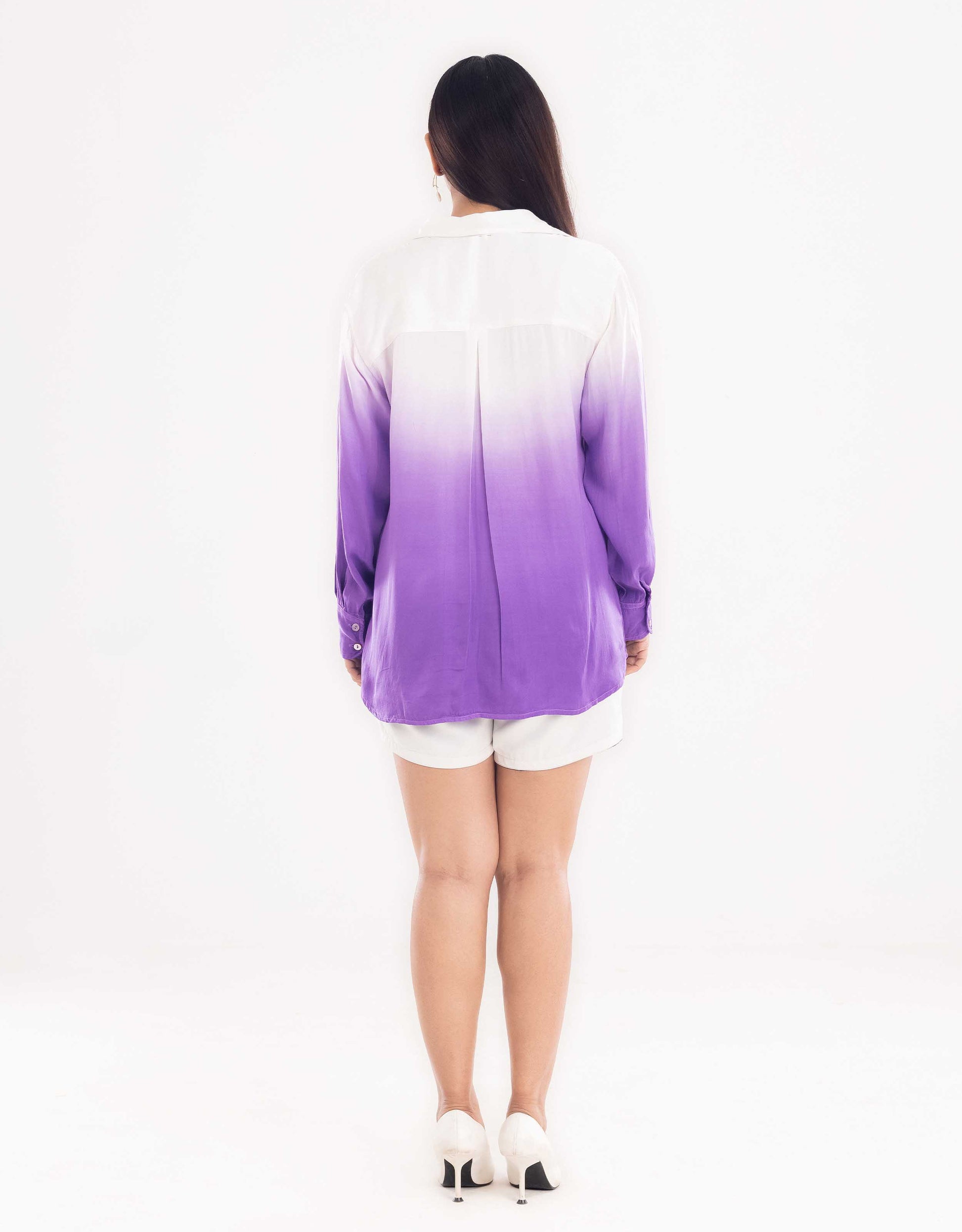 Back view display of Hueloom's Cosmopolitan capsule with oversized shirt, bandeau top and shorts in purple.