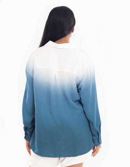 Back view display of Hueloom's Cosmopolitan capsule with oversized shirt, bandeau top and shorts in teal.